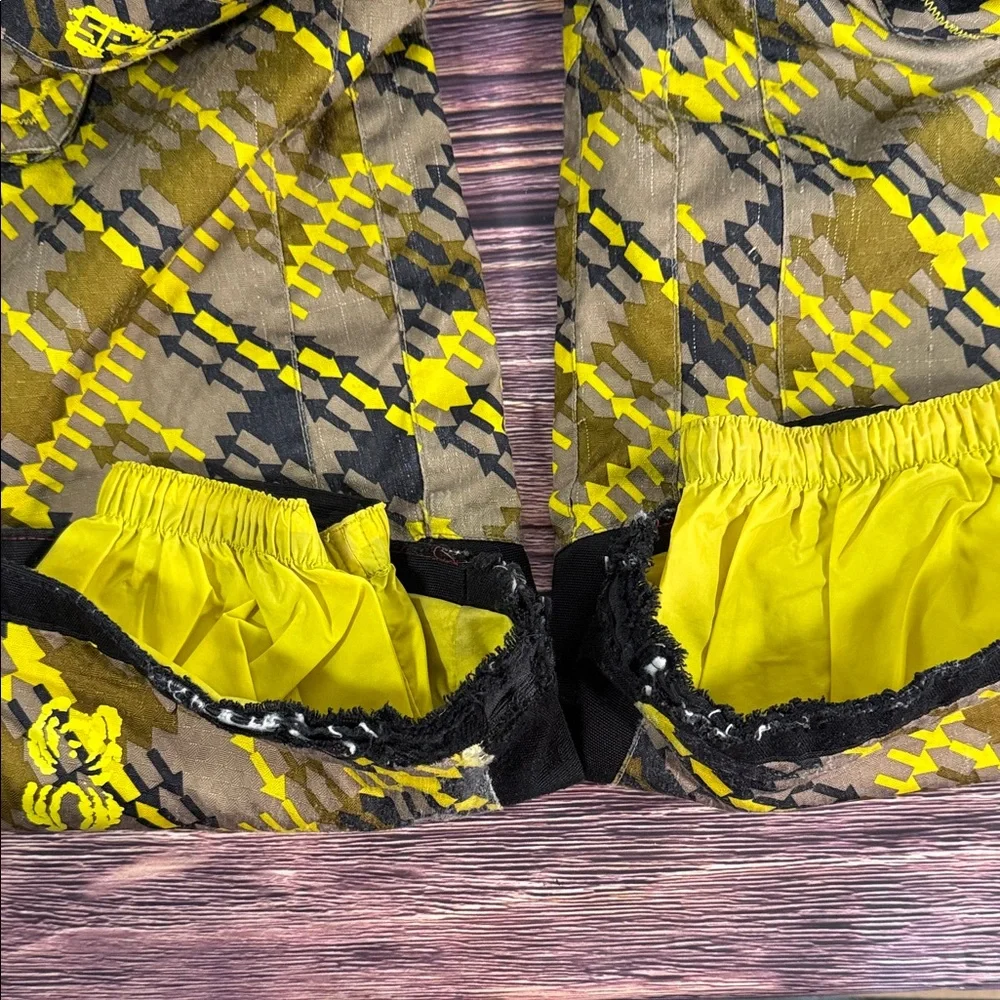 SPYDER Boys' Propulsion ski pants with an olive, black, and yellow plaid pattern